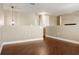Bonus room with hardwood floors and neutral walls offers versatile space for relaxing or entertaining at 2736 Suncoast Lakes Blvd, Punta Gorda, FL 33980