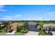 A two-story home features a manicured lawn, a two-car garage, and an inviting front entrance at 2736 Suncoast Lakes Blvd, Punta Gorda, FL 33980