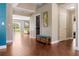 Entry foyer with hardwood floors connects to the living spaces with a view to the backyard at 2736 Suncoast Lakes Blvd, Punta Gorda, FL 33980