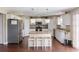Spacious kitchen featuring white cabinets, granite countertops, stainless steel appliances, and a center island at 2736 Suncoast Lakes Blvd, Punta Gorda, FL 33980
