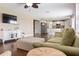 Open-concept living room flowing into the kitchen features hardwood floors and comfortable furnishings at 2736 Suncoast Lakes Blvd, Punta Gorda, FL 33980