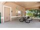 Poolside covered seating area, featuring a picnic table, public restrooms, and a water fountain at 2736 Suncoast Lakes Blvd, Punta Gorda, FL 33980
