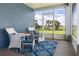 Relaxing screened porch with wicker furniture and view of the manicured backyard at 2736 Suncoast Lakes Blvd, Punta Gorda, FL 33980