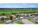 Picturesque street view of lovely homes with well manicured lawns adding curb appeal at 2736 Suncoast Lakes Blvd, Punta Gorda, FL 33980