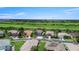 A charming street view showcases well-maintained homes with manicured lawns in a tranquil neighborhood setting at 2736 Suncoast Lakes Blvd, Punta Gorda, FL 33980