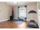 Spacious room equipped with fitness equipment, hardwood floors, and natural light at 2736 Suncoast Lakes Blvd, Punta Gorda, FL 33980