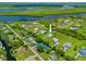 Aerial view of the property showing its location near a lake at 28960 Gin Ln, Punta Gorda, FL 33982