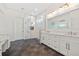 Stylish bathroom with dual vanity, a glass shower, and marble countertops at 28960 Gin Ln, Punta Gorda, FL 33982
