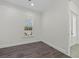 Bright bedroom features wood-look floors, a window, and ample outlets at 28960 Gin Ln, Punta Gorda, FL 33982