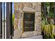 Entrance to The Estates on Peace River featuring a stone pillar with the community name at 28960 Gin Ln, Punta Gorda, FL 33982