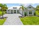 Charming single-Gathering home with a metal roof and brick paver driveway at 28960 Gin Ln, Punta Gorda, FL 33982