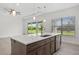 Beautiful kitchen island with stainless dishwasher and sink overlooking a stunning yard at 28960 Gin Ln, Punta Gorda, FL 33982