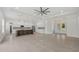 Bright and spacious kitchen with center island, white cabinetry, and stainless steel appliances at 28960 Gin Ln, Punta Gorda, FL 33982