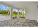 A covered portico entryway with pavers leads to the drive and the exterior of the house at 28960 Gin Ln, Punta Gorda, FL 33982