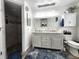 This bathroom boasts double sinks, and a large, walk in shower at 319 Kindred Blvd, Port Charlotte, FL 33954