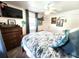 Bedroom featuring a bed, mounted television, ceiling fan and tropical decorations at 319 Kindred Blvd, Port Charlotte, FL 33954