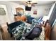 Charming bedroom featuring two twin beds, a ceiling fan, and a bright, inviting atmosphere at 319 Kindred Blvd, Port Charlotte, FL 33954