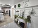 Stylish hallway with decorative wall accents, a console table, and a view into the kitchen and dining area at 319 Kindred Blvd, Port Charlotte, FL 33954
