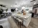 Spacious kitchen island with seating, pendant lighting, and a view into the open living area at 319 Kindred Blvd, Port Charlotte, FL 33954
