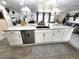 Kitchen island featuring a stylish countertop, stainless steel appliances, and decorative pendant lighting at 319 Kindred Blvd, Port Charlotte, FL 33954