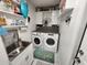 This laundry room has a modern washer and dryer, along with a wash sink at 319 Kindred Blvd, Port Charlotte, FL 33954