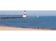 Lighthouse on pier with blue water and sky, offering a scenic view of coastal architecture and landscape at 319 Kindred Blvd, Port Charlotte, FL 33954