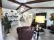 Open-concept living room with lots of natural light and a comfortable seating arrangement at 319 Kindred Blvd, Port Charlotte, FL 33954