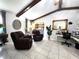 Bright living room featuring beamed ceiling and a dedicated home office area at 319 Kindred Blvd, Port Charlotte, FL 33954