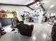 Open-concept living room featuring built-in shelving and bright natural lighting at 319 Kindred Blvd, Port Charlotte, FL 33954
