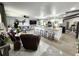Open-concept living space features a large island with seating, modern finishes, and comfortable furniture at 319 Kindred Blvd, Port Charlotte, FL 33954