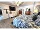 The main bedroom features cool toned walls, wood floors, and ample space at 319 Kindred Blvd, Port Charlotte, FL 33954