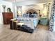 A relaxing main bedroom features a king-size bed with stylish bedding and decorative accents at 319 Kindred Blvd, Port Charlotte, FL 33954