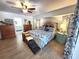 This main bedroom features cool toned walls, wood floors, and ample space at 319 Kindred Blvd, Port Charlotte, FL 33954
