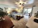 This main bedroom features cool toned walls, wood floors, with pool views and ample space at 319 Kindred Blvd, Port Charlotte, FL 33954