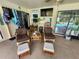 Enclosed patio with seating area and television has access to the swimming pool at 319 Kindred Blvd, Port Charlotte, FL 33954
