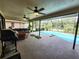 Screened-in patio offers a comfortable seating area and a view of the sparkling pool at 319 Kindred Blvd, Port Charlotte, FL 33954