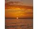 Spectacular sunset view over the ocean, with the sun reflecting on the calm water at 319 Kindred Blvd, Port Charlotte, FL 33954