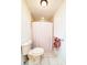 Bathroom featuring a toilet, shower/tub, and a towel bar with a colorful towel at 3456 Highlands Rd, Punta Gorda, FL 33983