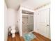Bathroom with wood floors includes a walk-in shower with glass doors and a toilet at 3456 Highlands Rd, Punta Gorda, FL 33983