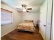 Cozy bedroom with hardwood floors, ceiling fan, and ample natural light at 3456 Highlands Rd, Punta Gorda, FL 33983