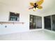 Sunroom with tile floors and views of the backyard and canal at 3456 Highlands Rd, Punta Gorda, FL 33983