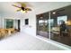 Sunroom with tile floors and views of the backyard and canal at 3456 Highlands Rd, Punta Gorda, FL 33983