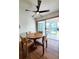 Cozy dining area with hardwood floors, a round table, and sliding glass doors leading to a patio at 3456 Highlands Rd, Punta Gorda, FL 33983