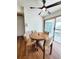 Dining area features hardwood floors, a round table, and access to an outdoor patio at 3456 Highlands Rd, Punta Gorda, FL 33983