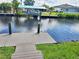 A relaxing dock view showcasing the canal and convenient boat lift, perfect for waterfront living at 3456 Highlands Rd, Punta Gorda, FL 33983