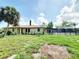 Charming one-story home with a well-manicured lawn and an enclosed pool area for outdoor entertainment at 3456 Highlands Rd, Punta Gorda, FL 33983