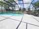 Inviting enclosed pool with bright blue water, surrounding patio, and outdoor seating for relaxation at 3456 Highlands Rd, Punta Gorda, FL 33983