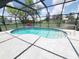 Screened-in pool area with bright blue water, white tile deck, and a safety preserver for added safety at 3456 Highlands Rd, Punta Gorda, FL 33983
