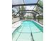 Screened-in pool with bright blue water offers a private and refreshing outdoor retreat at 3456 Highlands Rd, Punta Gorda, FL 33983