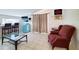Sitting room with wet bar features tile floors, a tv, and a retro-style refrigerator at 3456 Highlands Rd, Punta Gorda, FL 33983
